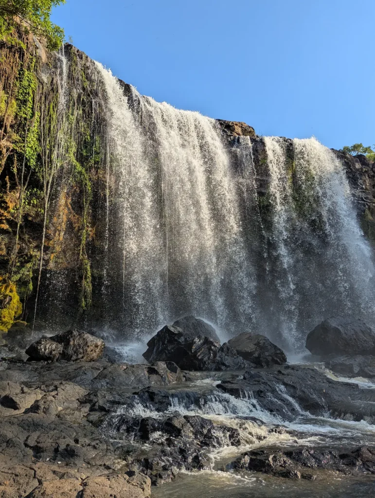 Portrait photo of a waterfall in the afternoon sunlight