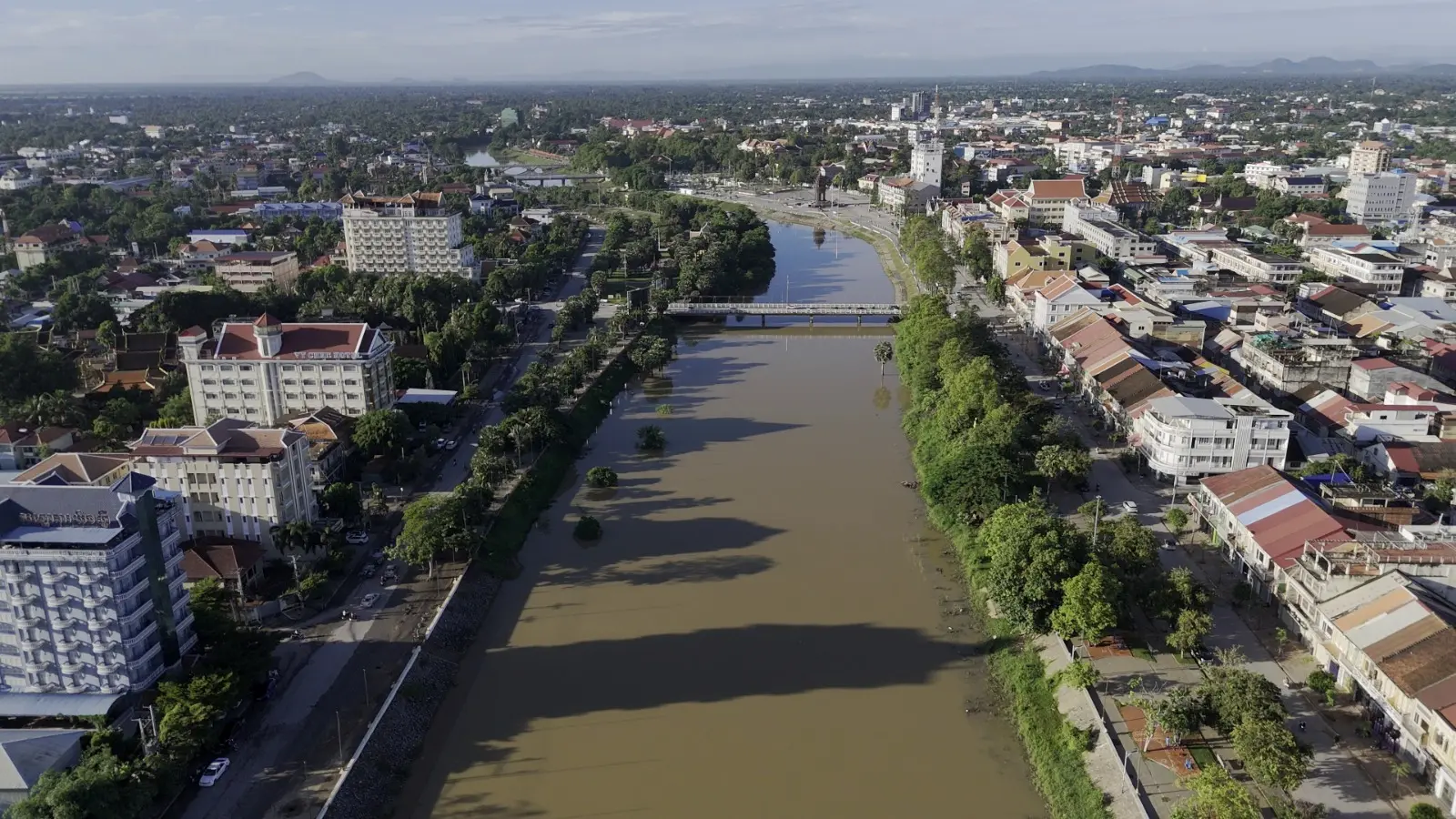 Drone shot of Battambang city with the river running through the middle of it.