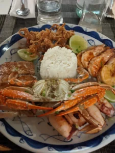 A seafood platter with prawns, crab, fish and breaded calamari