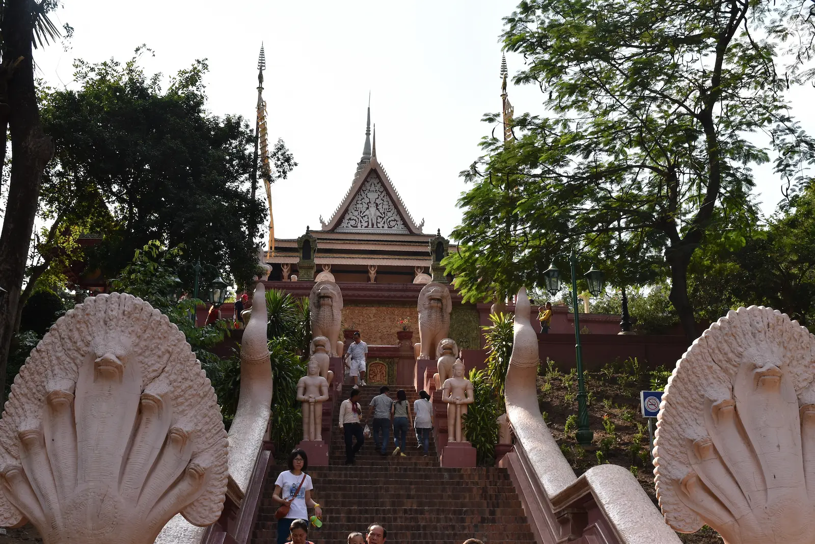 Two Nagas (dragon snakes) at the start of the stairs which lead to a pagoda.