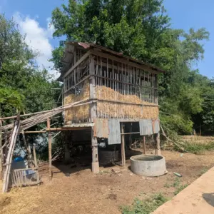 A small hut on stilts filled with Hay on Koh Trong Island