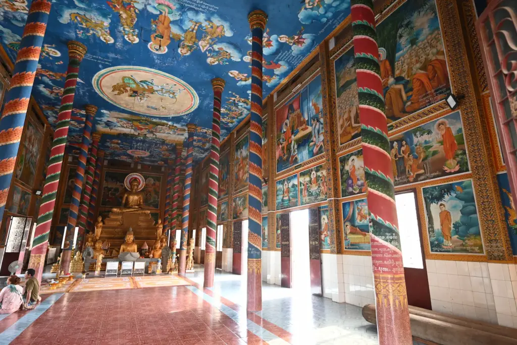 Inside the pagoda you can see more painted columns and vibrant murals on the walls and ceiling depicting scenes from Buddha.