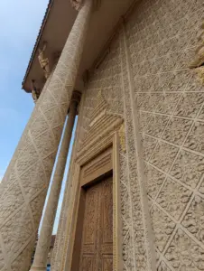 Close up of the lace like detail of a golden pink pagoda.