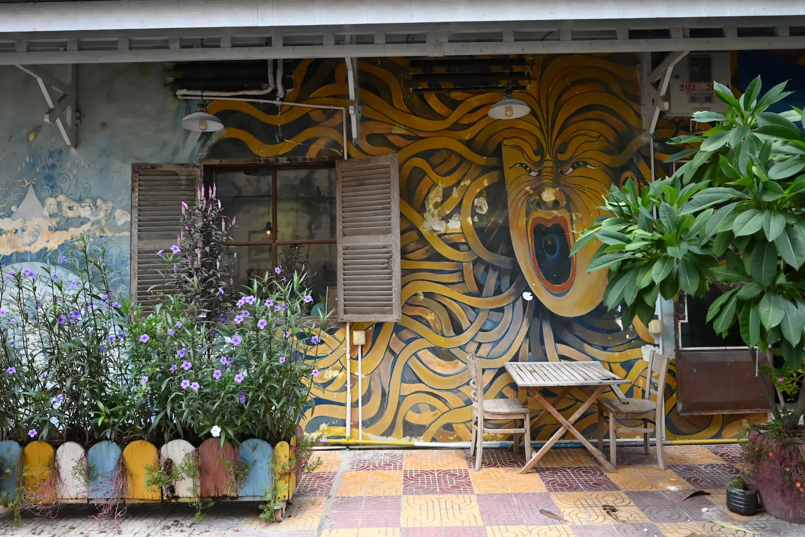 A Long Kosal mural on a building in Battambang.