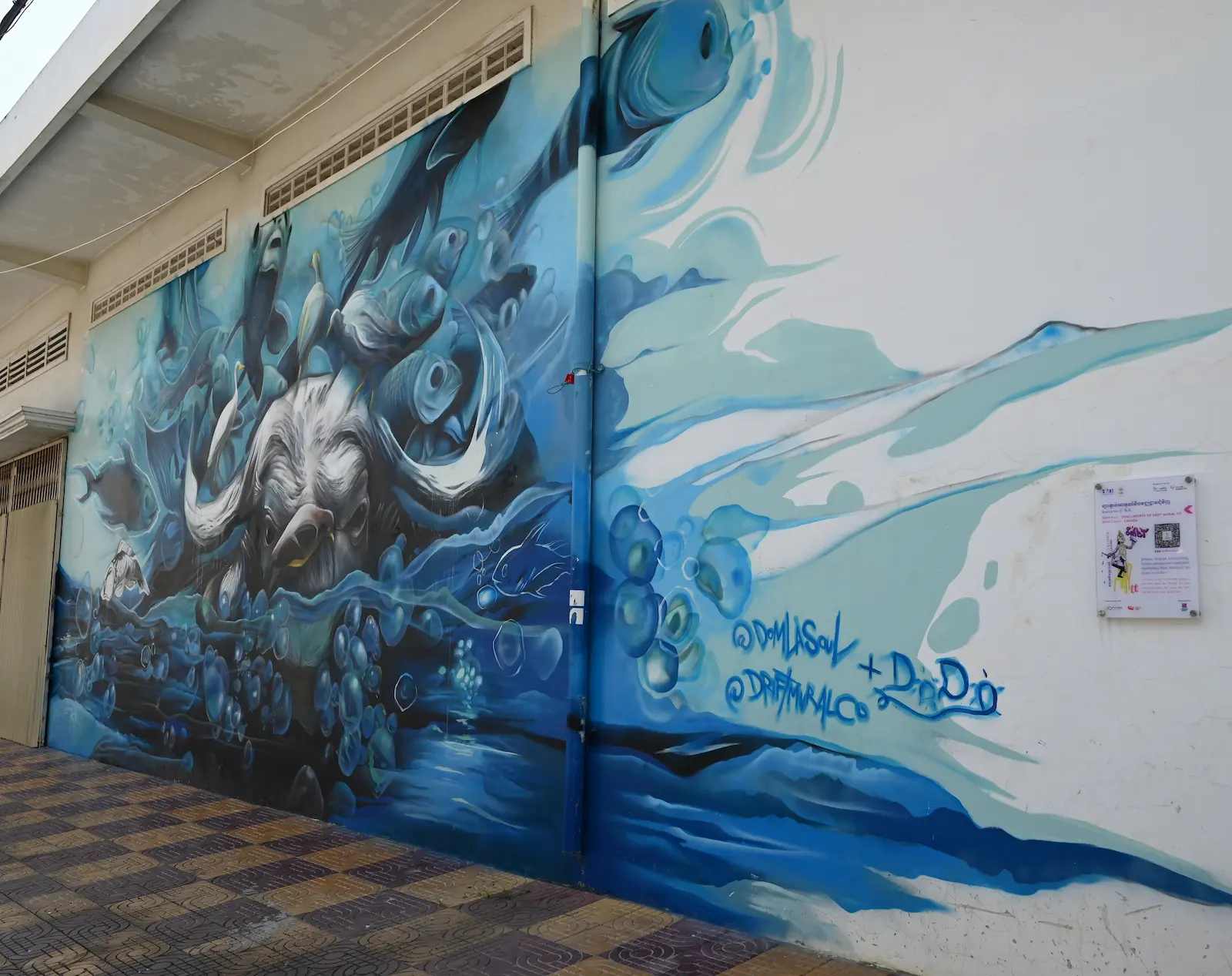 Large mural of a buffalo in water.