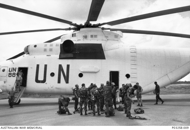 Malaysian troops in front of a UN Mi-26 transport helicopter at Battambang Airport during the UNTAC mission